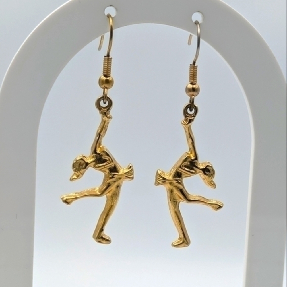 5/25$  Gold tone dancer dangle earrings